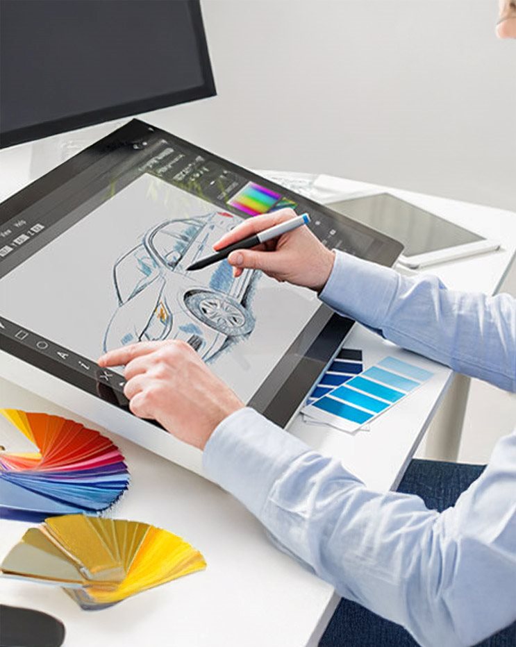 Student creating a digital product design sketch on a graphics tablet using color palettes